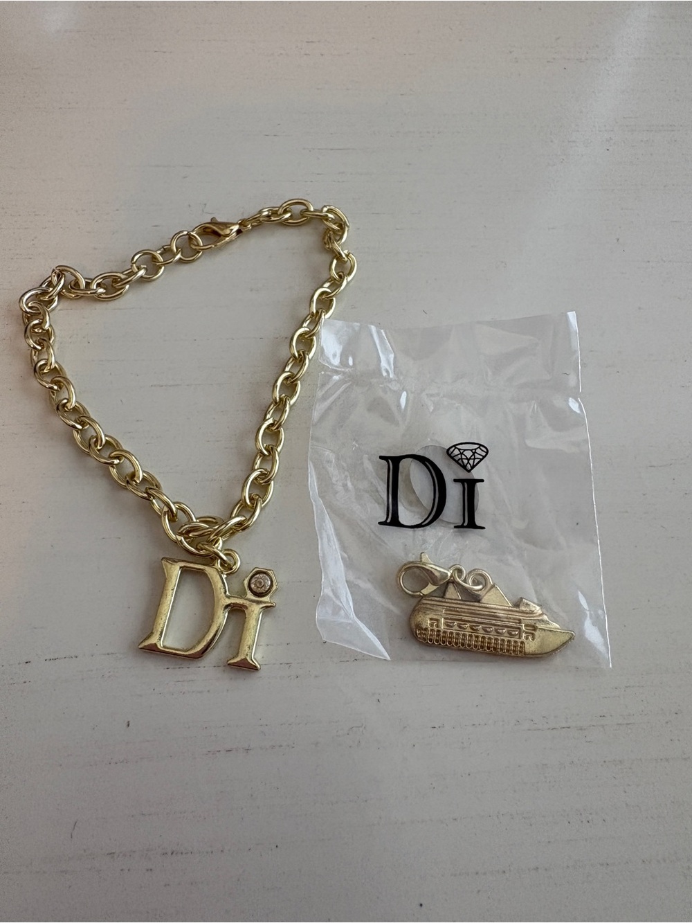 Diamond International Charm Gold-Tone Charm Bracelet w/ Cruise ship charm 🚢